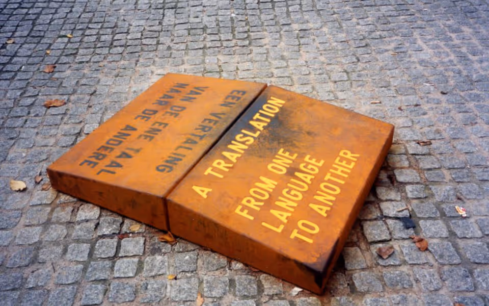 Picture of a dictionary with the word "translate" on the page