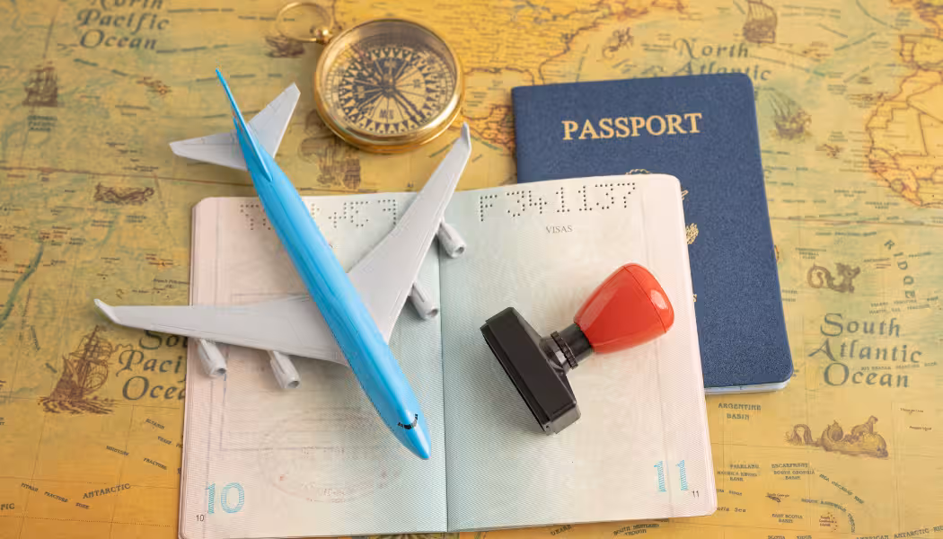 A collection of organized documents and a passport, ready for the visa application process.