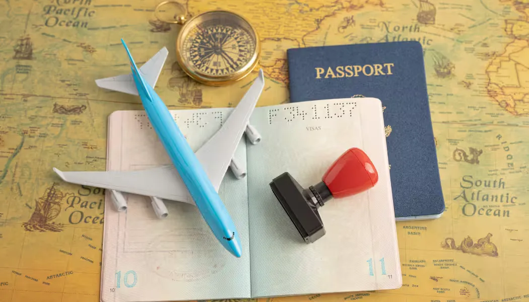 A collection of organized documents and a passport, ready for the visa application process.